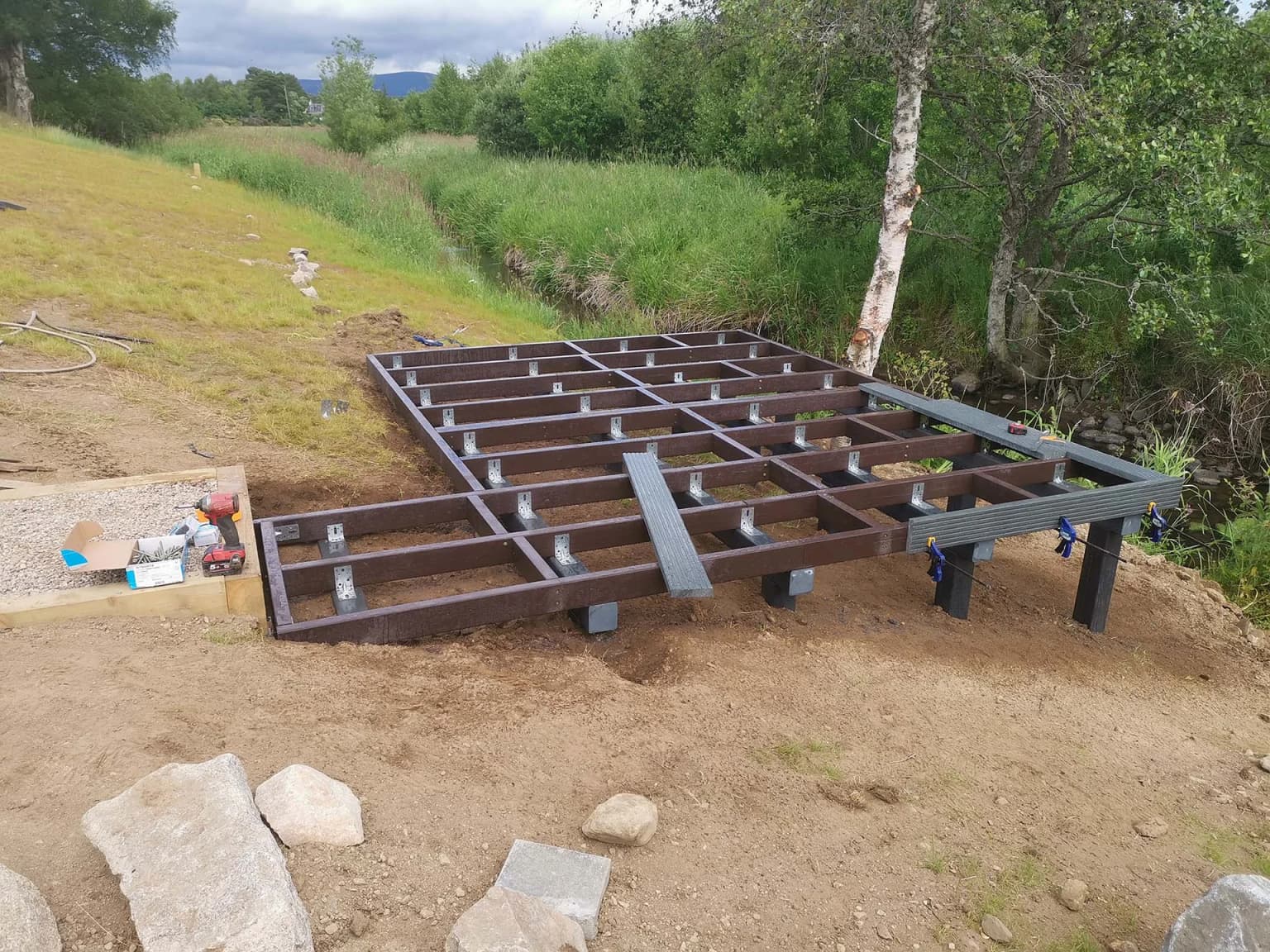 Recycled plastic decking installation in UK garden