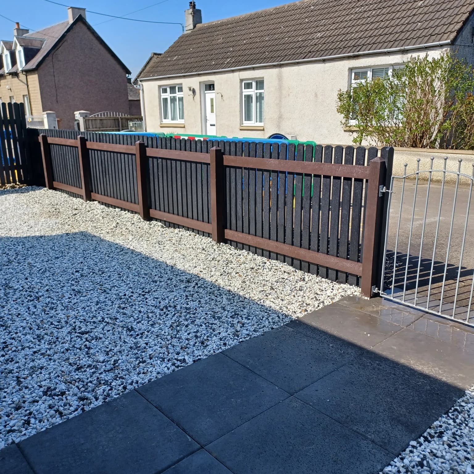Recycled plastic garden fence installation